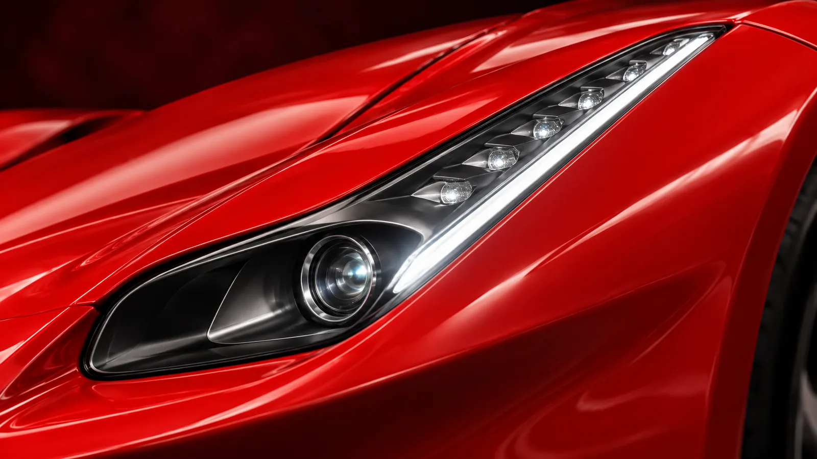 Sculpted red fender and narrow LaFerrari headlamp in a strip of light.