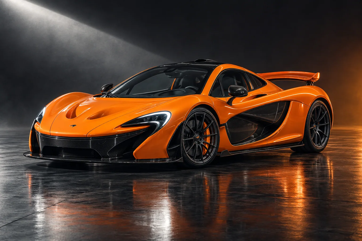Papaya-orange production McLaren P1, its carbon roof and sculpted sides lit in a graphite studio.