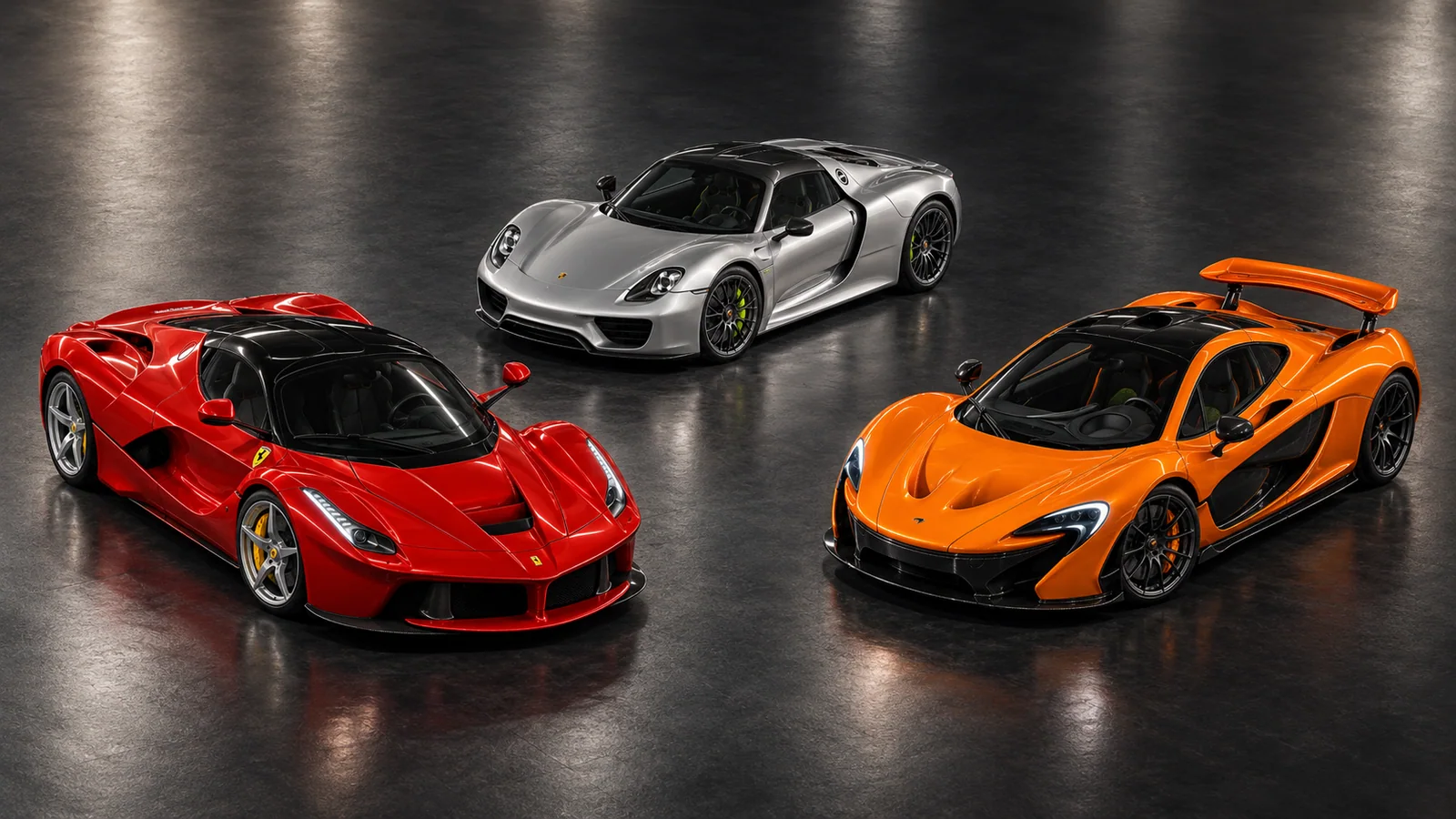 The red LaFerrari, orange McLaren P1 and silver Porsche 918 united in one dramatic studio composition.